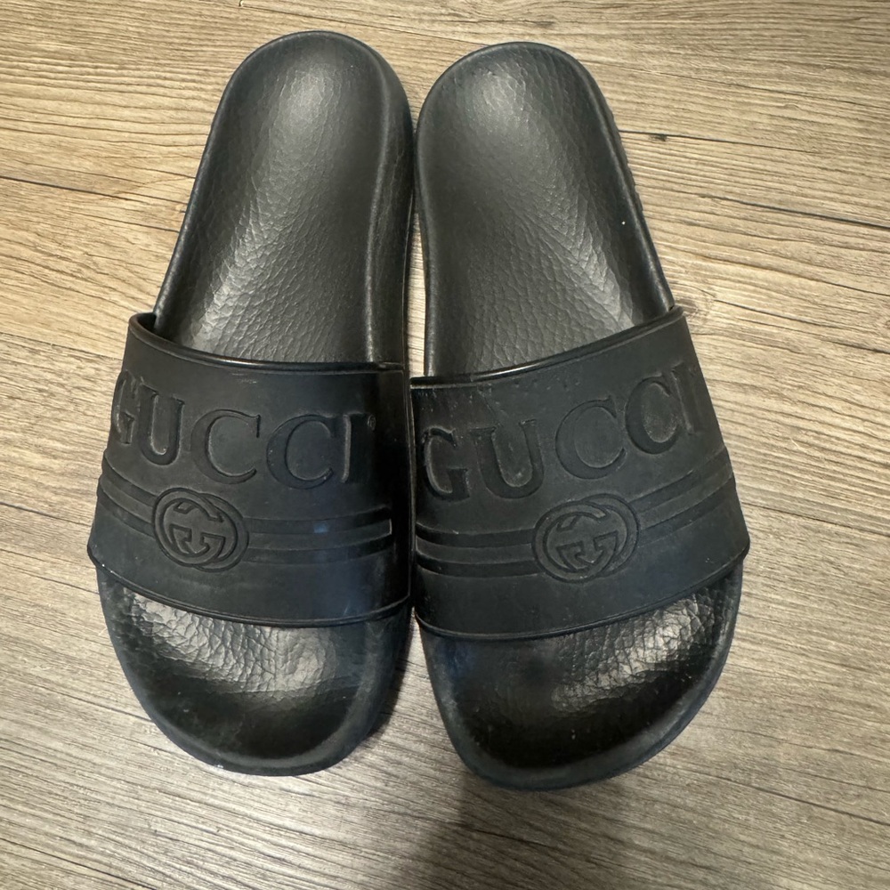 Gucci slides. Size 37. Very worn with tear. Comes with tags and box
